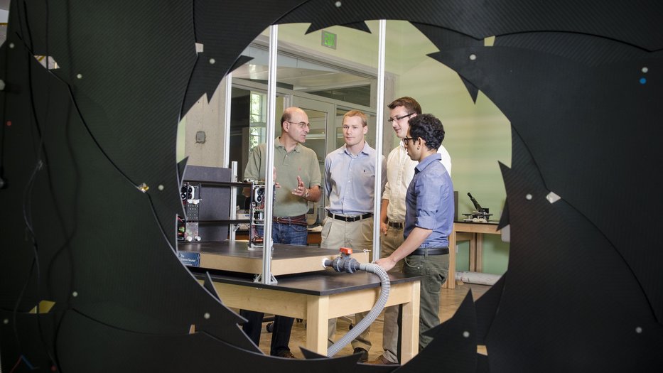 four people talking in Pellegrino Sergio Lab