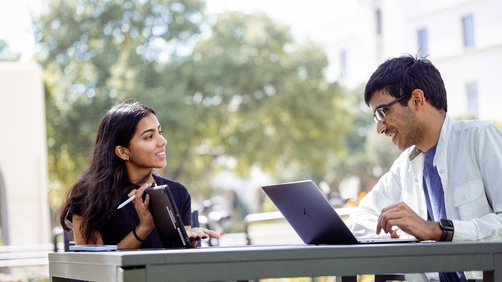 Two students working on an assignment. 