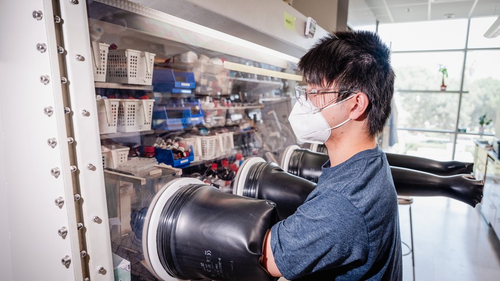 Student in a bio lab using incubator.