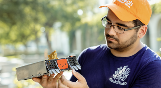 Student holding his project