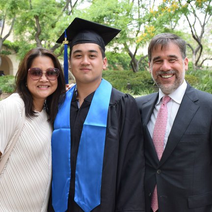 Chris and Rob Holo, pictured with their son, Sam (BS '16)
