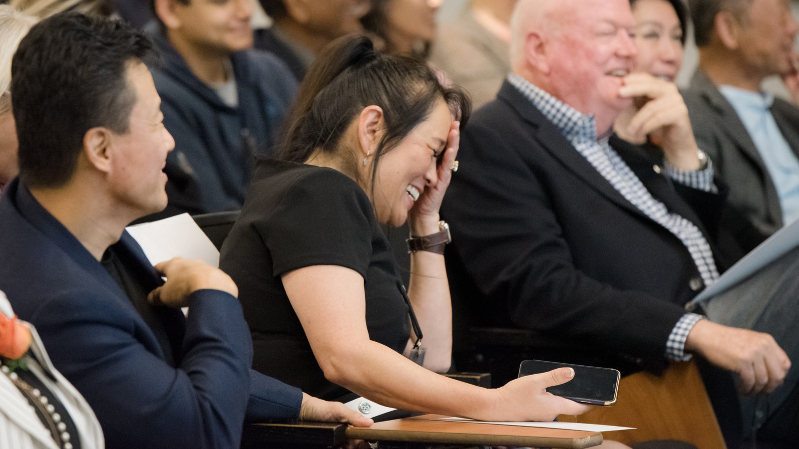 Members of the Caltech Associates convene for an event. A lady laughs.