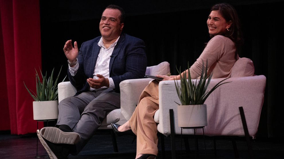 Hosea Nelson and Crystal Dilworth in chairs on stage at Beckman Auditorium