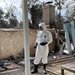 Professor Francois Tissot prepares to take dust samples from his Altadena home.