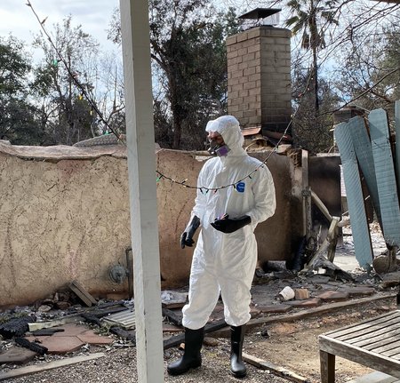 Professor Francois Tissot prepares to take dust samples from his Altadena home.
