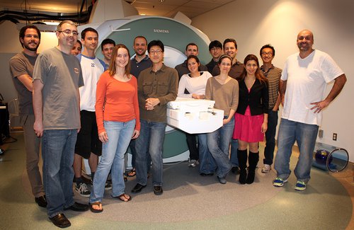 group photo in front of MRI machine