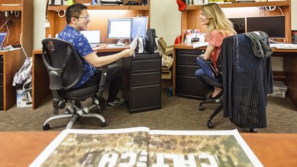 grad students meeting in their office