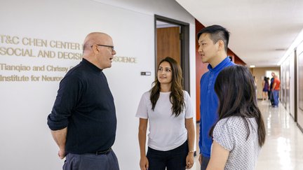 students in hallway with faculty member