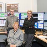 Maria, Ryan and Dr.Peck's Widow together in front of the controls