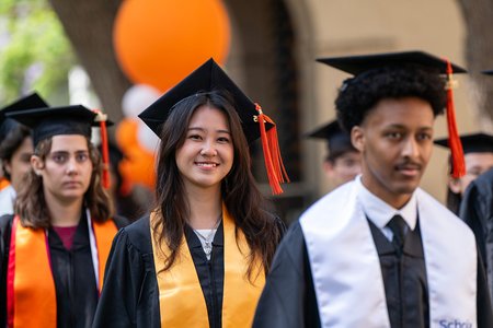 Three Caltech students enter the commencement ceremony