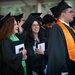 Four Caltech graduates standing at the close of their commencement ceremony