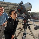 Garreth Ruane, a postdoctoral scholar in astronomy, shows visiting students from South Pasadena High School filtered views of the sun.