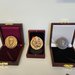 Three medals on display in their wooden boxes in John Dabiri's office.