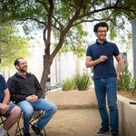 Joshua Frisch, Omer Tamuz, and Pooya Vahidi Ferdowsi discuss a math problem at Caltech.