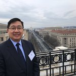 Photo of Caltech Alumnus Thomas Luke with Washington, D.C. in the background.