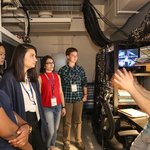 Graduate student Adam Shaw talks to prospective graduate students