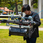 Caltech student setting up LATTICE demonstrator during a demo on campus