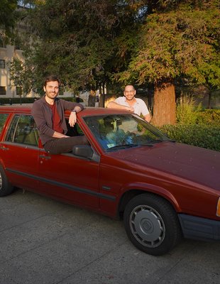 Luciano Pomatto (left) and Omer Tamuz pose in the 1995 Volvo station wagon.