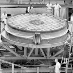 Workers pose with a 200-inch mirror, under construction for Palomar Observatory