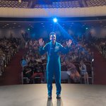 Jessica Watkins poses for a photo with the crowd in Beckman Auditorium