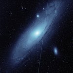 ZTF image of Andromeda galaxy with a Starlink streak through it.