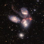 A group of colorful galaxies in space